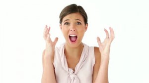 stock-footage-upset-woman-placing-her-hands-on-her-head-against-a-white-background